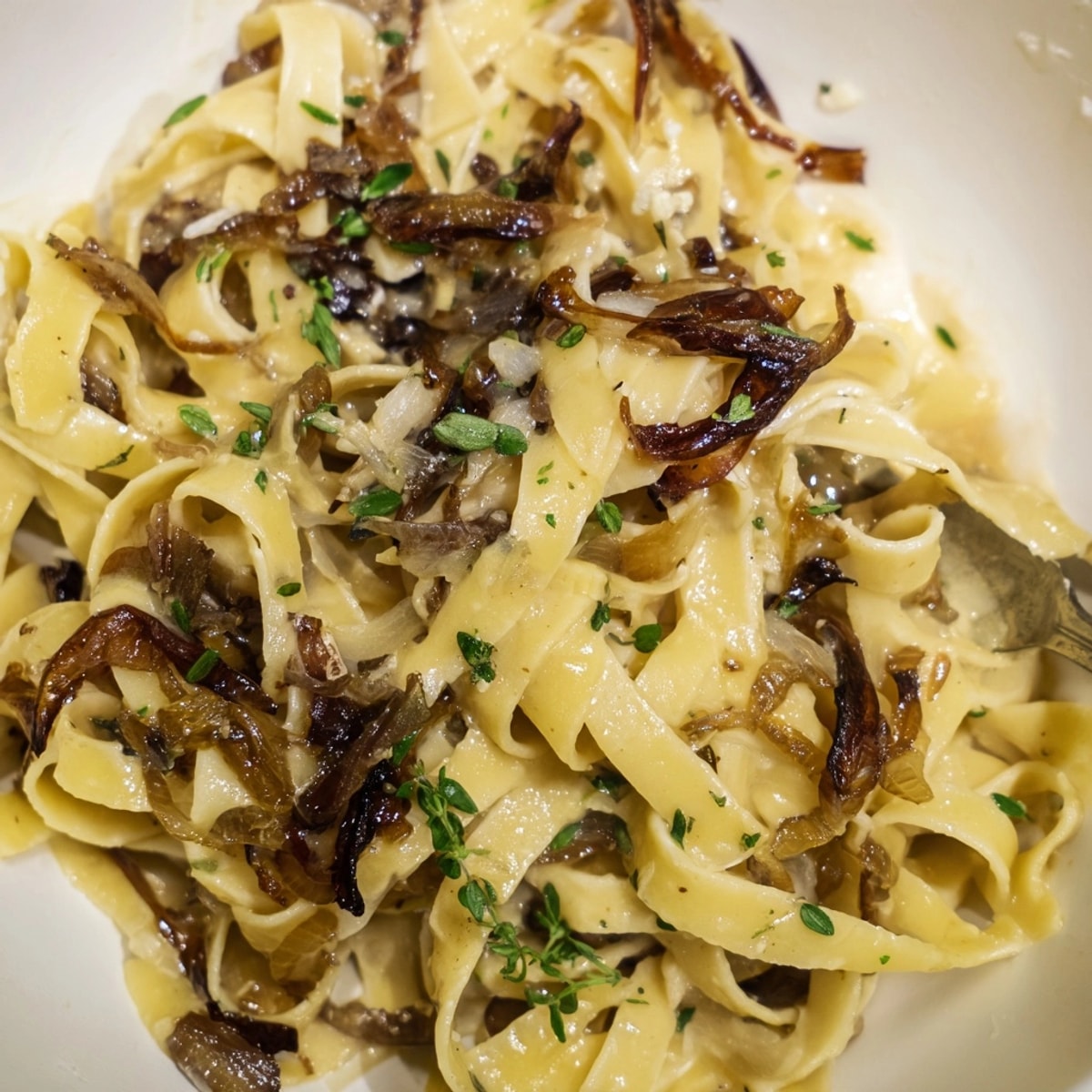 Creamy One-Pot French Onion Pasta with melted Gruyère cheese, ready to enjoy.