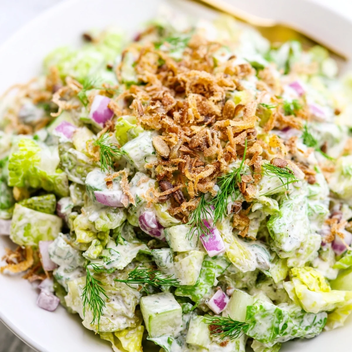 Crisp Dill Pickle Chopped Salad Crunch topped with sunflower seeds and fried onions.  