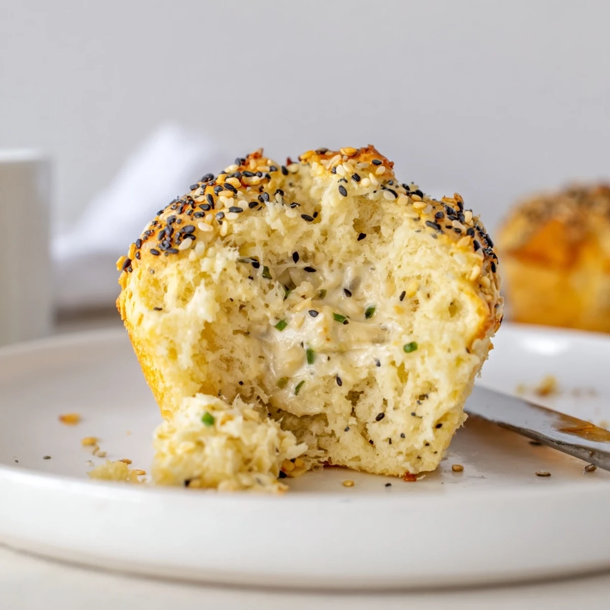 Warm, golden muffins with a creamy cheese center, perfect for breakfast or brunch.  
