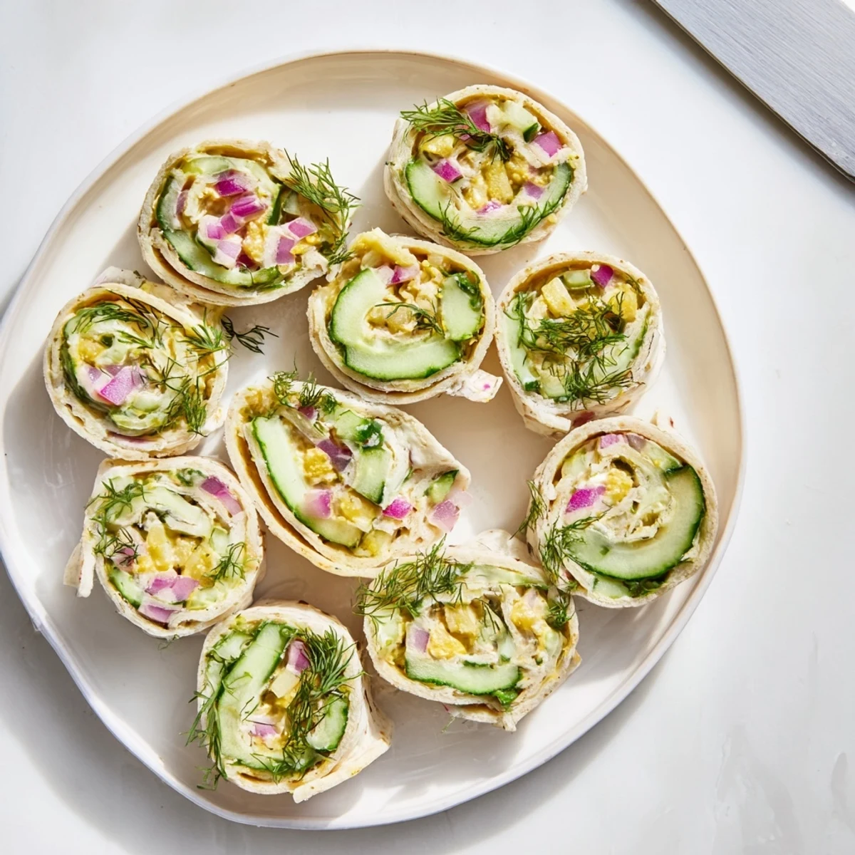 Crisp and creamy Pickle-in-a-Blanket snacks perfect for your next picnic.  