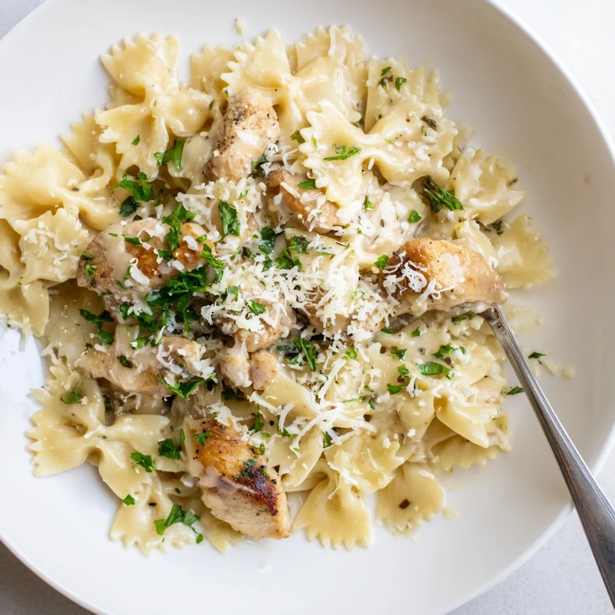 Deliciously melted mozzarella tops tender chicken and bowties in a garlic butter richness.  