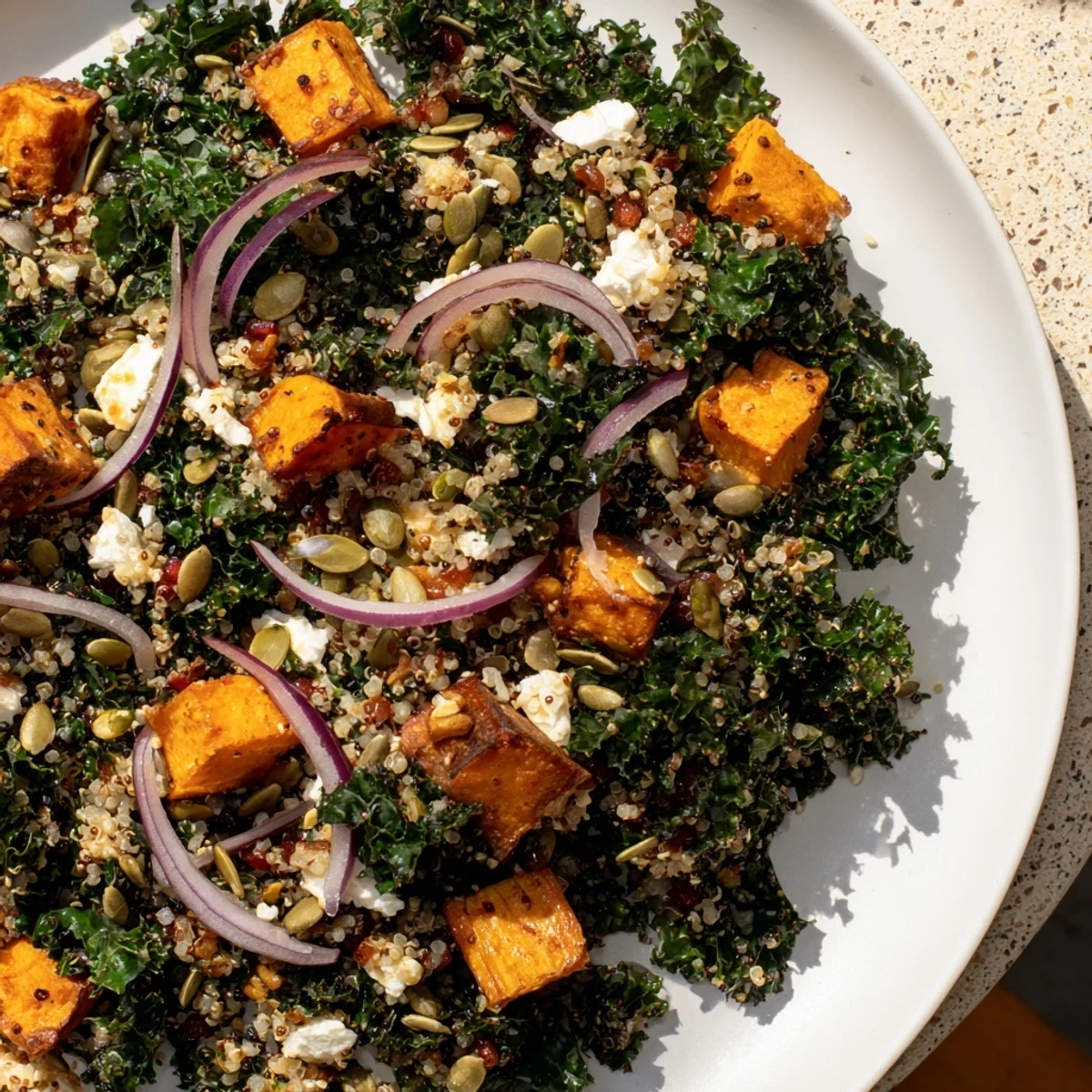 Fluffy quinoa and tender kale star in this Kale & Quinoa Salad, beautifully paired with sweet potatoes.