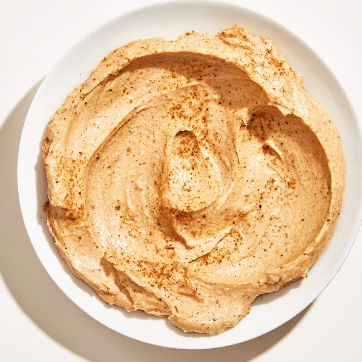 A delectable swirl of Christmas Cookie Butter spread, ready to be slathered on warm toast.