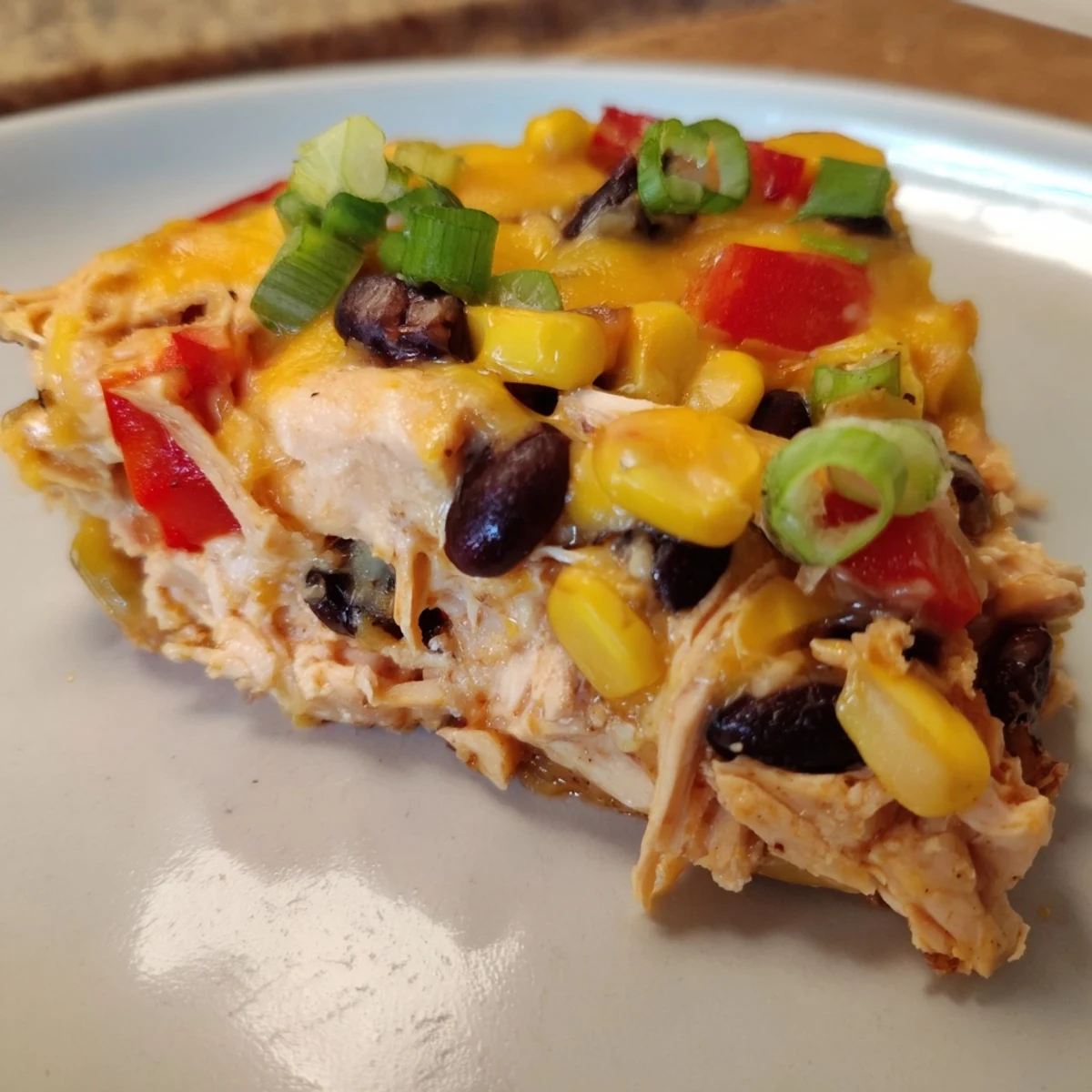 A hearty, homemade Taco Bell Copycat Chicken Bake showcasing layers of cheese, chicken, and tortilla.