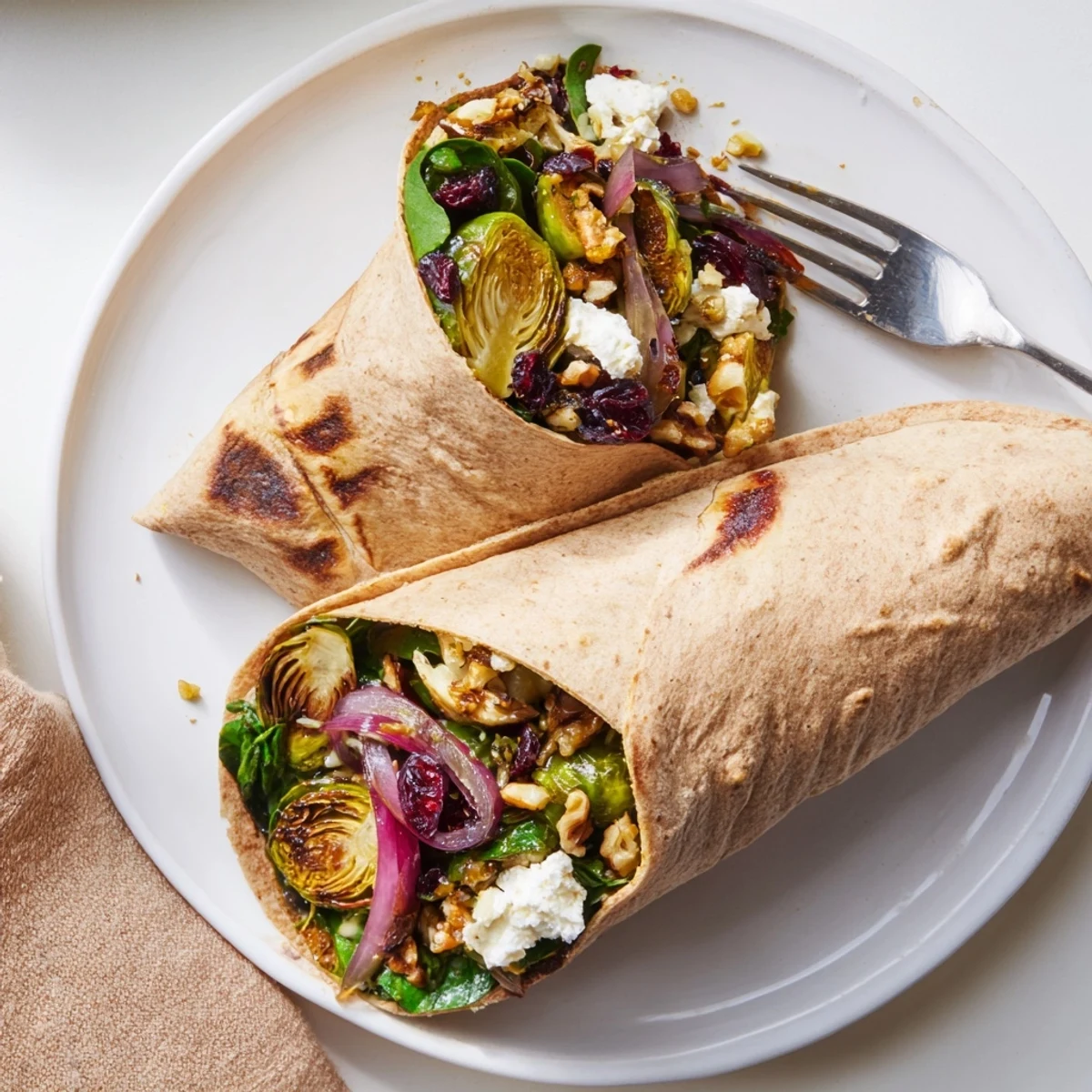 Golden roasted Brussels sprouts and cranberry grain wrap, bursting with flavor for a satisfying vegetarian lunch.