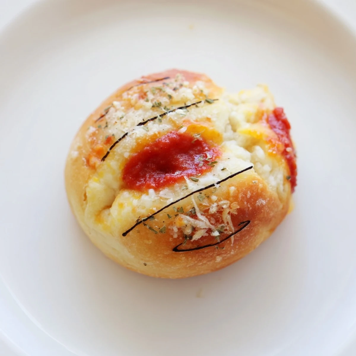 Golden brown Slam Dunk Basketball Pizza Bites, ready to dip in pizza sauce for game day.