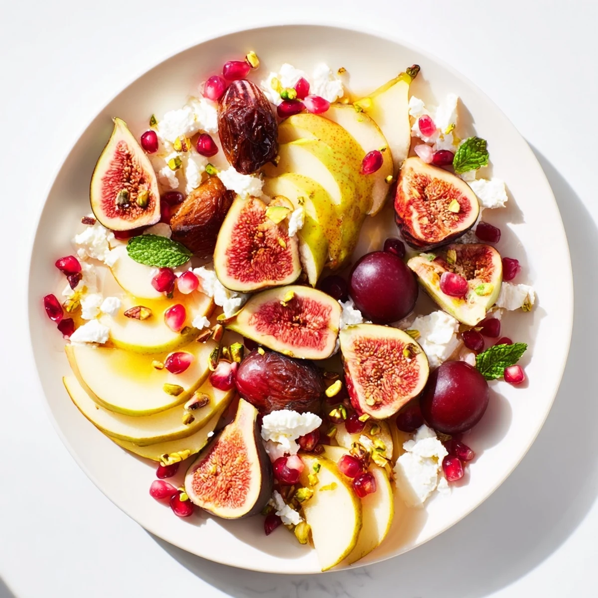 Vibrant Winter Fruit: Fig and Date Snowdrift Platter, drizzled with honey, perfect for entertaining.