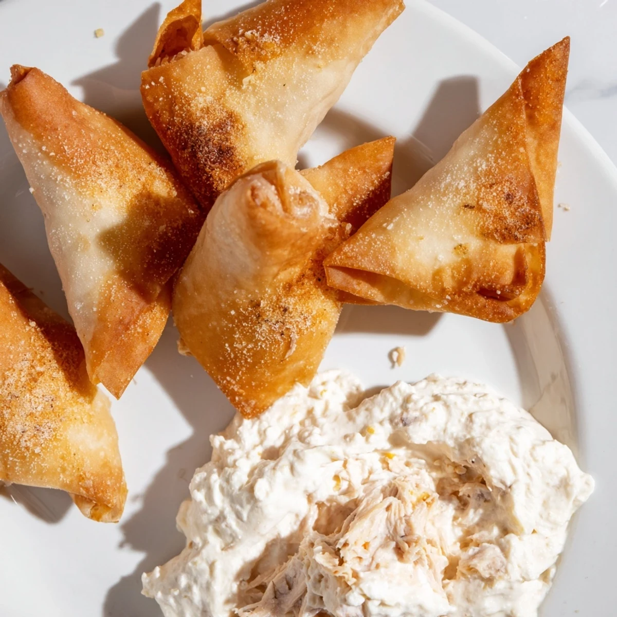 Air fryer lumpia chips: perfectly crunchy, salted wrappers ready for dipping into the flavorful chicken dip.