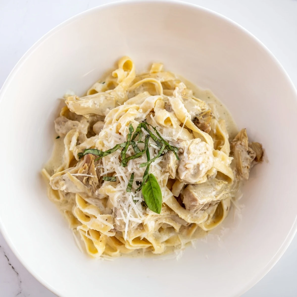Visualize a plate piled high with perfectly cooked creamy lemon artichoke pasta, ready to enjoy tonight.