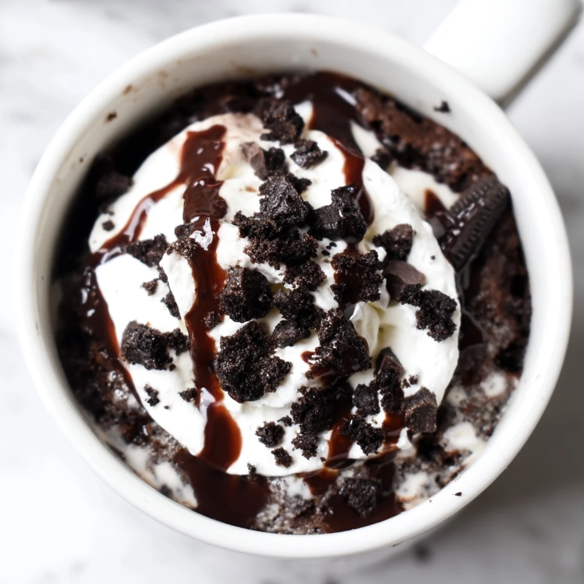 Fudgy Oreo mug cake, perfectly portioned for a quick, single-serving dessert in minutes.