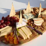 Visually stunning Sailboat Cheese Platter with colorful fruit and assorted cheeses ready to serve.