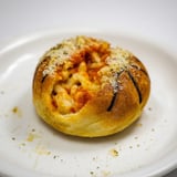 A close-up shot of delicious, cheesy Slam Dunk Basketball Pizza Bites, perfectly bite-sized and fun.