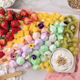 Vibrant Magical Unicorn Rainbow Dessert Board, a perfect dessert centerpiece for joyful celebrations and parties.