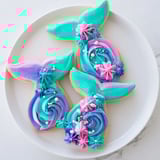 Vibrant teal, pink, and purple buttercream create colorful Mermaid Tail Under the Sea Sweets, a dreamy dessert.