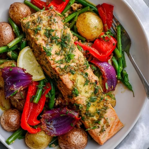 Savory Lemon Herb Salmon & Potato Sheet Pan ready to serve with crispy edges.  