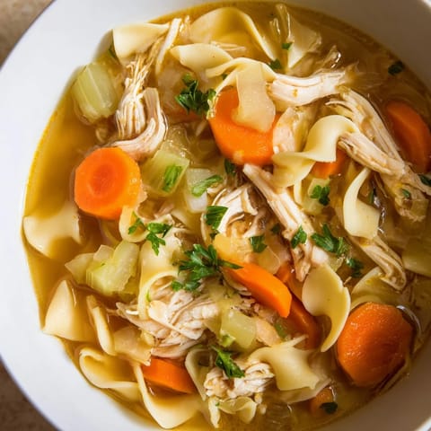 This comforting homemade chicken noodle soup, with tender chicken and herbs, is perfect for a chilly evening.