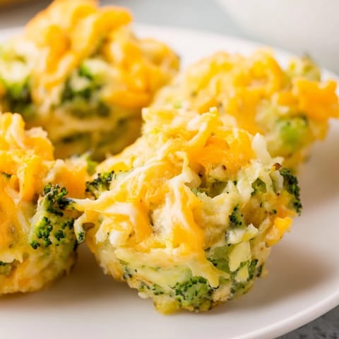 Close-up of baked Cheesy Broccoli Casserole Bites showing a cheesy, savory texture.