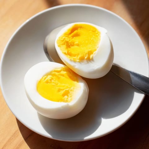 Enjoy tender Air Fryer Boiled Eggs; see the creamy, vibrant yolks in this easy snack.
