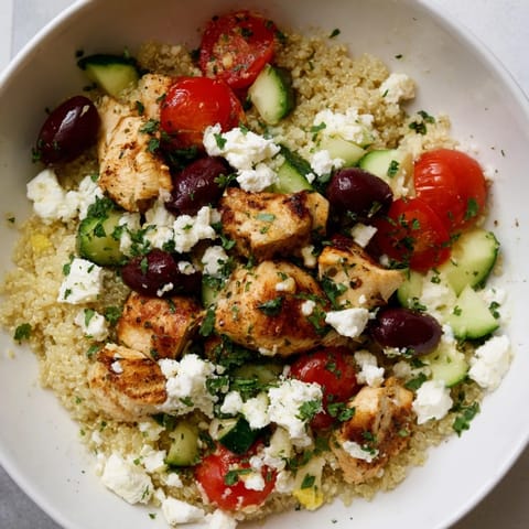 Mediterranean Chicken Bowl with colorful veggies and lemon-oregano dressing, ready to serve for a healthy meal.  