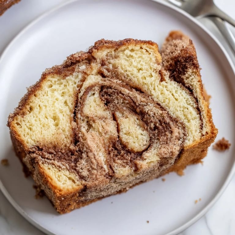Tender Maple Ginger Cinnamon Sugar Pancake Muffin Loaf topped with cinnamon sugar for extra flavor.