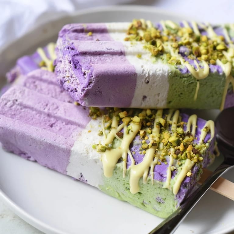 Delightful ube & pistachio ice cream bars, drizzled with condensed milk and nuts.  