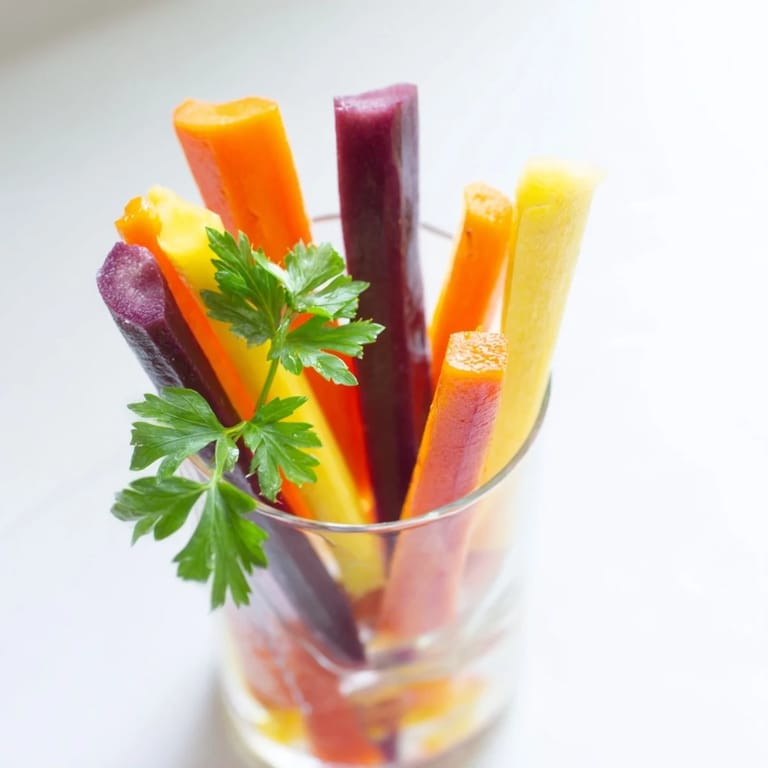 Upright Simple Crudités in elegant glasses: A colorful display of carrot sticks, beautifully presented, an easy appetizer.