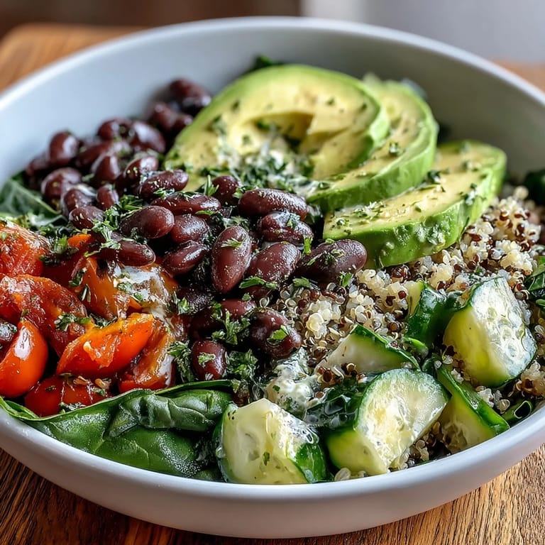 Fork-ready Three-Bean Power Bowl featuring chickpeas, black beans, and crisp veggies, finished with toasted seeds for a nutritious dinner.
