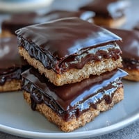 Celebrate graduation with decorated sugar cookies shaped like graduation caps, topped with smooth royal icing.